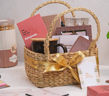 Load image into Gallery viewer, eco-friendly gift hamper in basket with dry fruits snacks mug and corporate gifting items