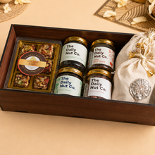 Load image into Gallery viewer, The Royal Fusion Box premium Diwali gift hamper with dry fruit barfi, rose cashews, Indian spiced raisins, paan shots, and gourmet snacks in an elegant gift box