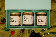 Load image into Gallery viewer, The Elite Bliss Box premium Diwali gift hamper with Indian Spiced Raisins, Indian Spiced Cashews, and Seed Mix in an elegant gift box