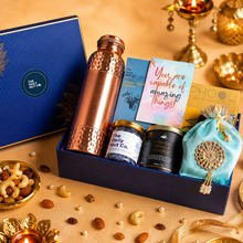 Load image into Gallery viewer, Luxe Treats Box premium Diwali gift hamper with gourmet treats, copper bottle, scented candle, and wellness essentials
